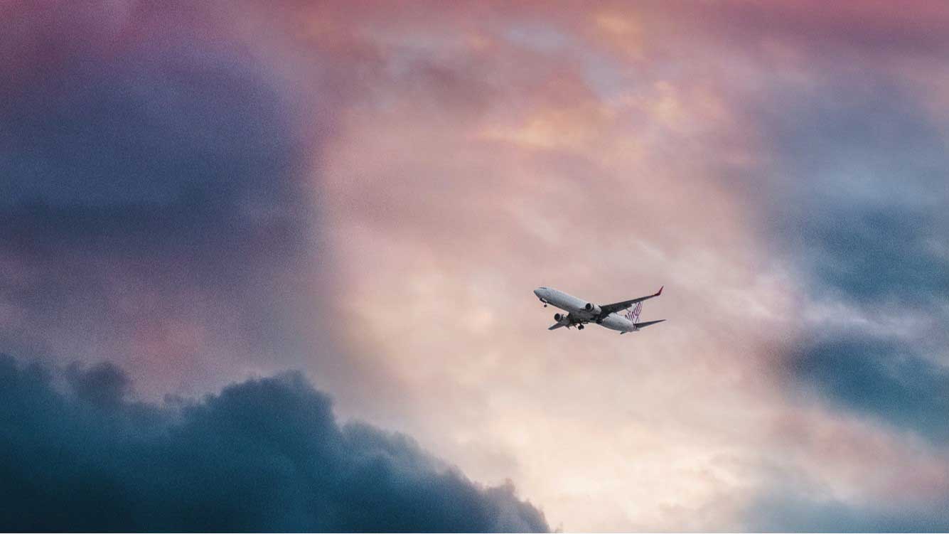 A picture of a plane in the sky