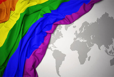 Pride flag over globe